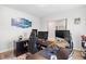 Spacious home office with desk and gaming chair setup with natural light at 1015 Saltgrass Way, Myrtle Beach, SC 29588