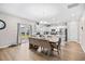 Bright, eat-in kitchen with white cabinetry, stainless appliances, and sliding door to the yard at 1015 Saltgrass Way, Myrtle Beach, SC 29588
