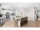 Open kitchen with a modern design, large island and stainless steel appliances at 1015 Saltgrass Way, Myrtle Beach, SC 29588