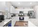 Modern kitchen with stainless steel appliances, granite countertops, and ample cabinet space at 1015 Saltgrass Way, Myrtle Beach, SC 29588