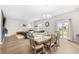 Open-concept living and dining area featuring hardwood floors and lots of natural light at 1015 Saltgrass Way, Myrtle Beach, SC 29588