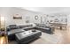 Spacious living room featuring an modern sectional sofa and hardwood flooring at 1015 Saltgrass Way, Myrtle Beach, SC 29588