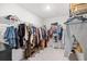 Walk-in closet complete with metal shelving to store a variety of clothing items at 1015 Saltgrass Way, Myrtle Beach, SC 29588