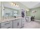 Spacious bathroom featuring double vanity sinks, granite countertops, and walk-in shower, for spa-like retreat at 1028 Whooping Crane Dr., Conway, SC 29526