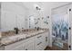 Well-lit bathroom with double granite vanity, white cabinets, modern fixtures, and a separate toilet with shower at 1028 Whooping Crane Dr., Conway, SC 29526