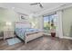 Relaxing bedroom with tray ceilings, a wooden bed frame, and a serene green color scheme at 1028 Whooping Crane Dr., Conway, SC 29526
