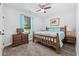 Cozy bedroom featuring a wood bed frame, cool blue accents, and neutral walls for a tranquil escape at 1028 Whooping Crane Dr., Conway, SC 29526