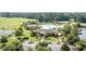 Aerial view of a resort-style community pool surrounded by lush landscaping and amenities at 1028 Whooping Crane Dr., Conway, SC 29526