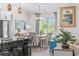Cozy dining area with natural light, a chandelier, and views into the backyard at 1028 Whooping Crane Dr., Conway, SC 29526