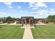 Grand modern home with a spacious front yard and impressive architectural details at 1028 Whooping Crane Dr., Conway, SC 29526