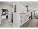 Modern kitchen featuring white cabinets, subway tile backsplash, stainless steel appliances, and hardwood floors at 1028 Whooping Crane Dr., Conway, SC 29526
