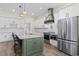 Bright, modern kitchen with white cabinets, stainless appliances, and a contrasting kitchen island at 1028 Whooping Crane Dr., Conway, SC 29526
