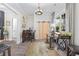 Bright living room with bike-themed décor, hardwood floors, barn door, modern lighting, and lots of sunlight at 1028 Whooping Crane Dr., Conway, SC 29526