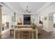 Bright living room featuring a fireplace, sleek fan, and sliding glass doors to the patio at 1028 Whooping Crane Dr., Conway, SC 29526