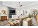 Elegant living room with contemporary fireplace, wood-look flooring, and stylish decor at 1028 Whooping Crane Dr., Conway, SC 29526