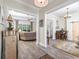 Open-concept living spaces with wood floors and multiple areas for entertaining and relaxation at 1028 Whooping Crane Dr., Conway, SC 29526