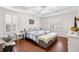 Inviting bedroom featuring tray ceilings, plantation shutters, and hardwood floors at 106 Willow Ridge Rd., Myrtle Beach, SC 29588