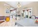 Bright dining area with modern chandelier flows into the updated kitchen and a sunlit outdoor patio space at 106 Willow Ridge Rd., Myrtle Beach, SC 29588