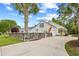 Exterior view of home with palm trees and fenced-in yard at 106 Willow Ridge Rd., Myrtle Beach, SC 29588
