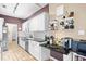 Updated kitchen features white cabinetry, granite countertops, and a convenient coffee bar area at 106 Willow Ridge Rd., Myrtle Beach, SC 29588