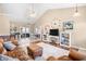 Spacious living room with vaulted ceilings, hardwood floors, and a cozy seating area with a ceiling fan at 106 Willow Ridge Rd., Myrtle Beach, SC 29588