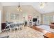 Open concept living room features stylish tile flooring, vaulted ceilings, and great natural light throughout at 106 Willow Ridge Rd., Myrtle Beach, SC 29588