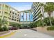 Inviting entrance to Coral Beach Resort with covered drive, convenient parking, and lush landscaping at 1105 S Ocean Blvd. # 630, Myrtle Beach, SC 29577