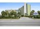 Exterior view of the Coral Beach Resort, showcasing its modern architecture, landscaping, and proximity to the beach at 1105 S Ocean Blvd. # 630, Myrtle Beach, SC 29577