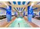 Unique indoor pool area with aquatic-themed columns, tropical foliage and relaxing hot tub at 1105 S Ocean Blvd. # 630, Myrtle Beach, SC 29577