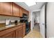 Modern kitchen featuring brown cabinets, granite countertops, and stainless steel appliances at 1105 S Ocean Blvd. # 630, Myrtle Beach, SC 29577