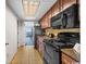Compact kitchen space featuring wooden cabinets and modern appliances at 1105 S Ocean Blvd. # 630, Myrtle Beach, SC 29577