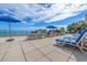 Spacious pool deck with lounge chairs and umbrellas offering ocean views for a relaxing getaway at 1105 S Ocean Blvd. # 630, Myrtle Beach, SC 29577