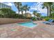Inviting pool area featuring lounge chairs, tropical landscaping, and clear blue skies at 1105 S Ocean Blvd. # 630, Myrtle Beach, SC 29577
