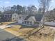 An elevated view shows a well-maintained home with a spacious yard in a tranquil neighborhood at 113 Edwards Ln., Longs, SC 29568