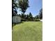 Expansive backyard featuring lush green grass and a charming storage shed in a well-maintained landscape at 113 Edwards Ln., Longs, SC 29568