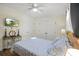 This bedroom features hardwood flooring, a ceiling fan, and great natural light at 113 Edwards Ln., Longs, SC 29568