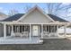 Inviting covered front porch with rocking chairs and benches, perfect for relaxing outdoors at 113 Edwards Ln., Longs, SC 29568