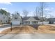 Charming single-story home features a welcoming front porch, attached garage, and manicured lawn at 113 Edwards Ln., Longs, SC 29568