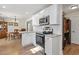 Bright kitchen featuring stainless steel appliances, white cabinets, and updated countertops with breakfast nook and dining area at 113 Edwards Ln., Longs, SC 29568