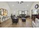 Welcoming living room with hardwood floors, neutral paint, and ample natural light at 113 Edwards Ln., Longs, SC 29568