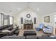 Spacious living room featuring high ceilings, hardwood floors, and a cozy fireplace at 113 Edwards Ln., Longs, SC 29568