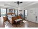 The main bedroom features a ceiling fan, access to the yard, and hardwood flooring at 113 Edwards Ln., Longs, SC 29568