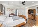 This main bedroom has a ceiling fan, neutral paint, and hardwood flooring at 113 Edwards Ln., Longs, SC 29568