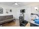 Bright office area features hardwood floors, large closets, and a comfortable chair and futon at 113 Edwards Ln., Longs, SC 29568