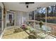 Relaxing screened porch with outdoor furniture, ceiling fan, and a view of the backyard at 113 Edwards Ln., Longs, SC 29568