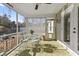 Inviting screened porch featuring a stylish rug, comfortable seating, and access to both interior and exterior spaces at 113 Edwards Ln., Longs, SC 29568