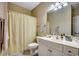 Bathroom with a shower-tub combo, vanity sink, and neutral-toned walls at 116 Cypress Point Ct. # 302, Myrtle Beach, SC 29579