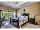 Comfortable main bedroom featuring a balcony, a queen-sized bed and ample natural light at 116 Cypress Point Ct. # 302, Myrtle Beach, SC 29579