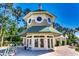 Elegant white and green building with striped awnings and round windows at 116 Cypress Point Ct. # 302, Myrtle Beach, SC 29579