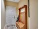 Inviting entryway with a coat rack and storage bench beside the front door at 116 Cypress Point Ct. # 302, Myrtle Beach, SC 29579